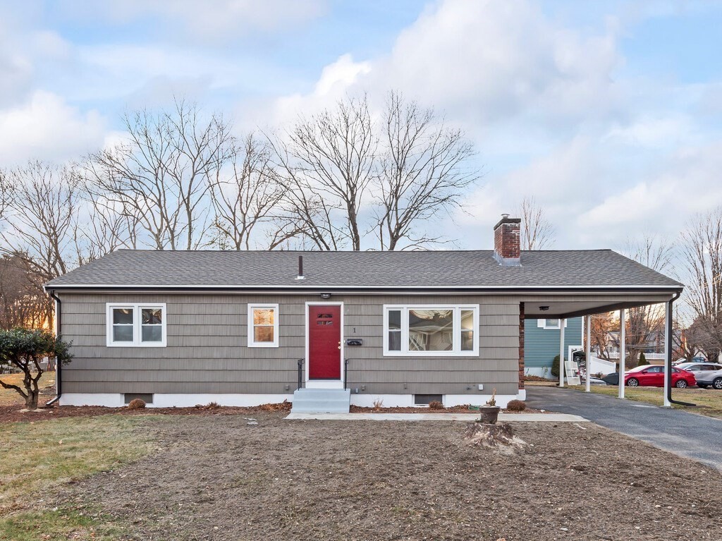 1 Foley Drive Framingham, MA 01701 - Photo 16 of 17 a front view of a house with a yard and garage