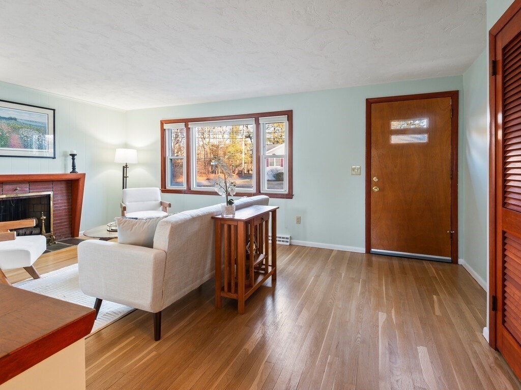 1 Foley Drive Framingham, MA 01701 - Photo 3 of 17 a living room with furniture and a fireplace