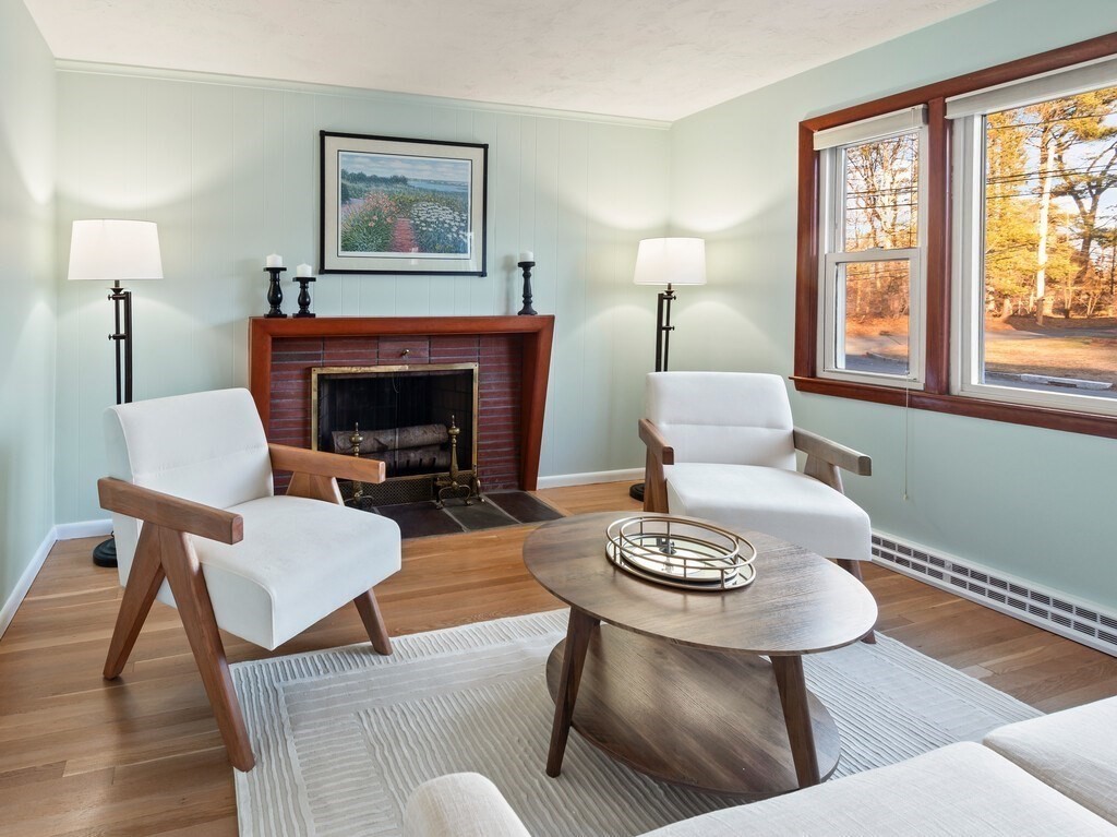1 Foley Drive Framingham, MA 01701 - Photo 4 of 17 a living room with furniture a fireplace and a large window