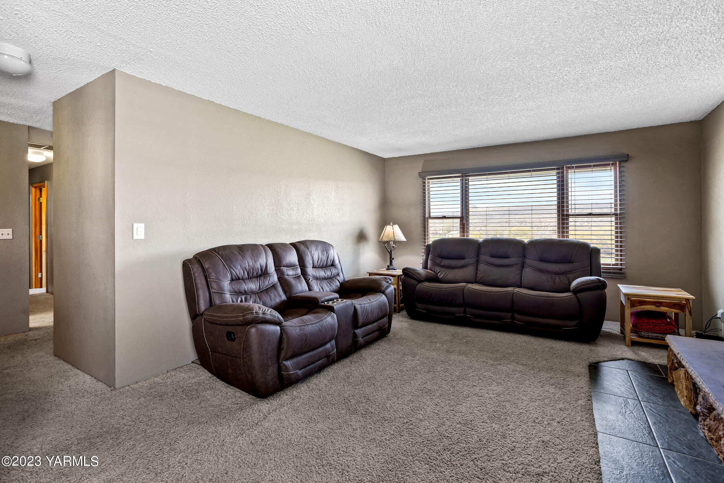 11902 Marble Road Yakima, WA 98908 - Photo 5 of 29 a living room with a couch and a window