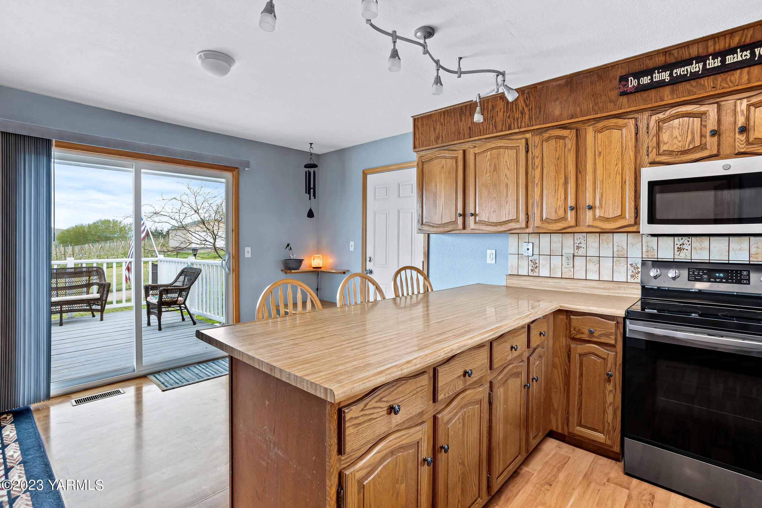11902 Marble Road Yakima, WA 98908 - Photo 8 of 29 a kitchen with granite countertop a stove cabinets and sink