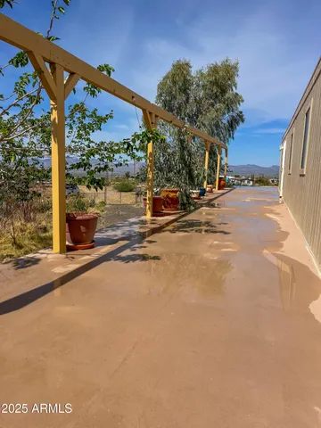 an aerial view of a house with a yard and lake view