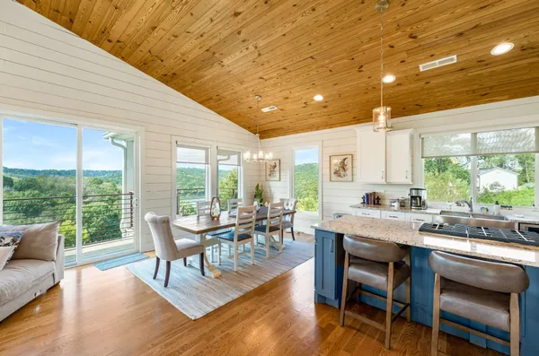 a dining room with furniture window and outside view