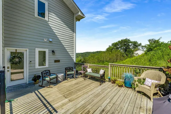 a view of a patio with a table and chairs