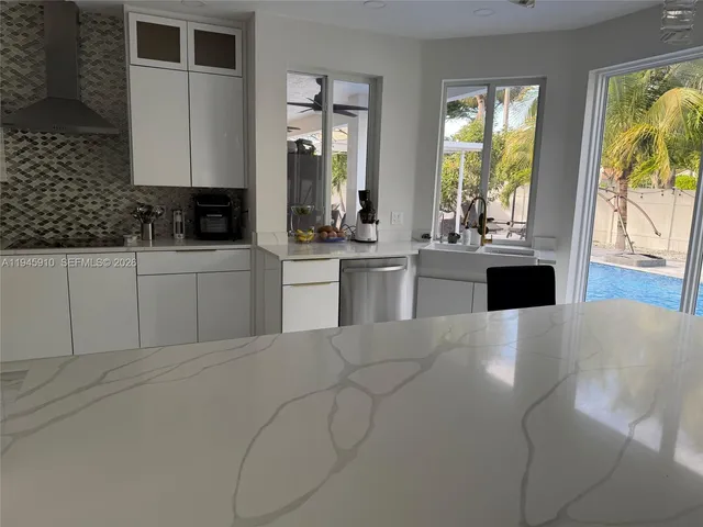 a large white cabinets in a kitchen