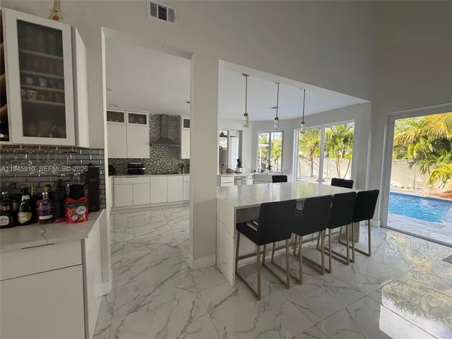 a view of a patio with couches and a fire pit