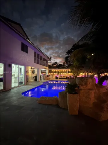 a bathroom with a sink mirror toilet and bathtub