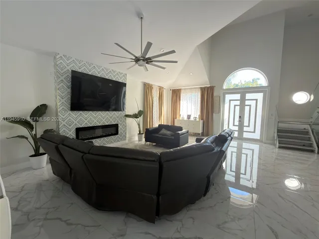 a living room with furniture and a flat screen tv
