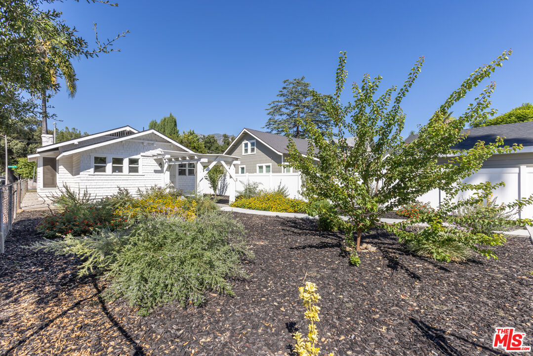 150 Dearborn Street Pasadena, CA 91103 - Photo 4 of 4 a view of a house with a yard and a large tree