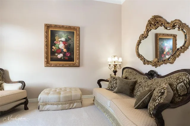 a living room with furniture a couch and a mirror