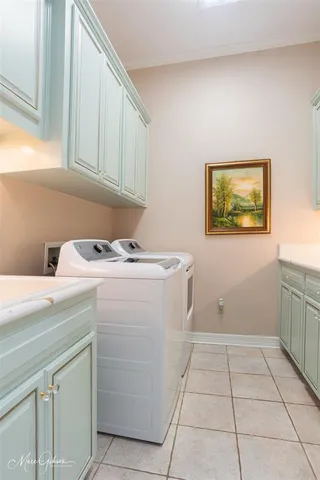 a utility room with washer and dryer
