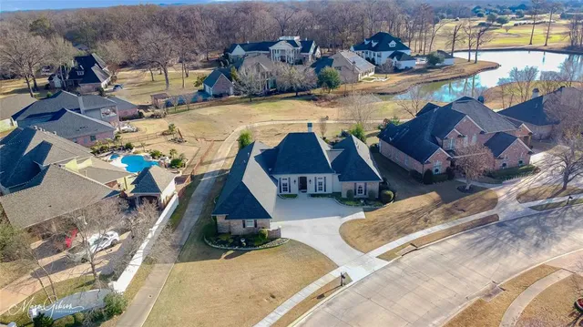 an aerial view of a house with swimming pool