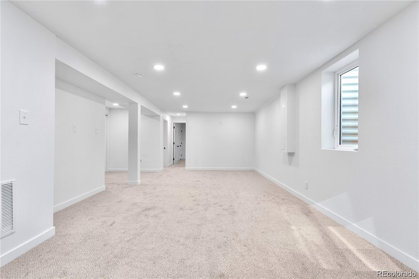 6500 West 32nd Avenue Wheat Ridge, CO 80033 - Photo 23 of 39 an empty room with windows and closet