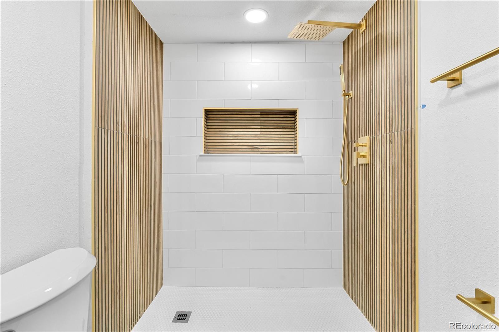 6500 West 32nd Avenue Wheat Ridge, CO 80033 - Photo 28 of 39 a bathroom with a shower