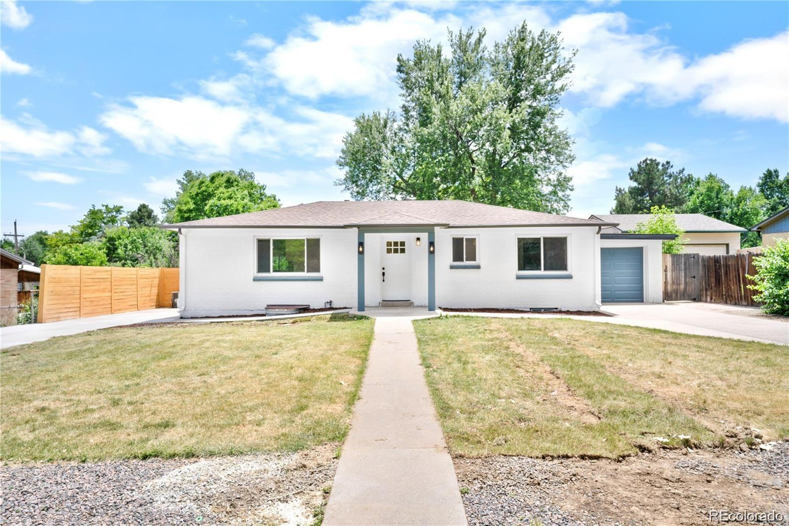 6500 West 32nd Avenue Wheat Ridge, CO 80033 - Photo 3 of 39 front view of a house with a patio