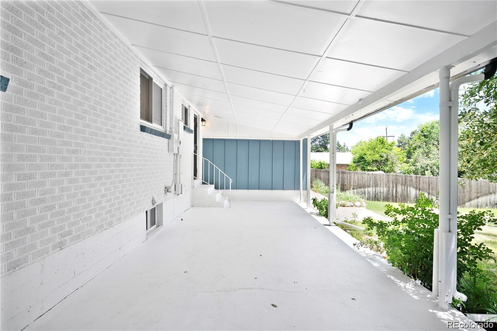 6500 West 32nd Avenue Wheat Ridge, CO 80033 - Photo 31 of 39 a bathroom with a sink and a large mirror