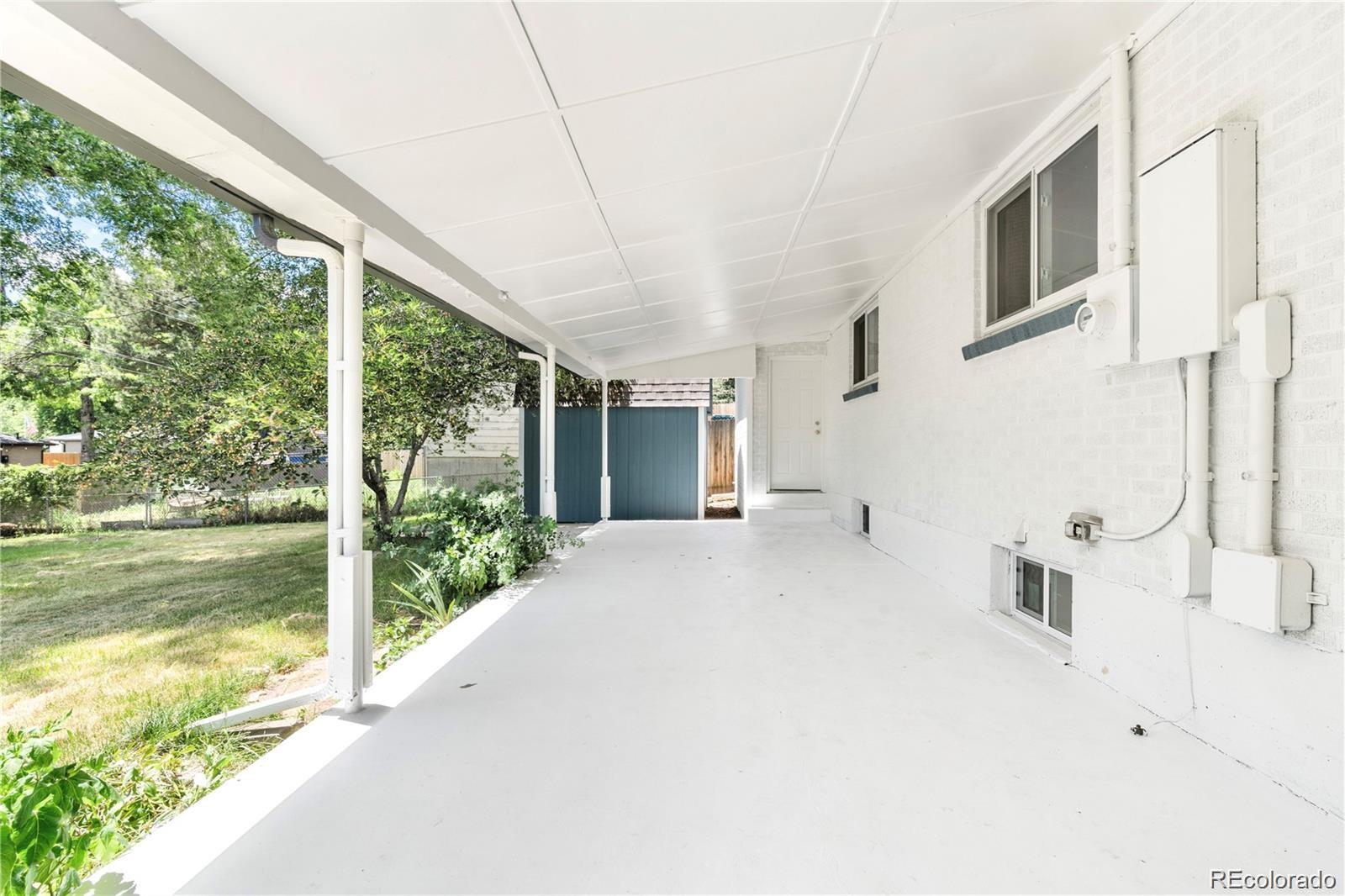 6500 West 32nd Avenue Wheat Ridge, CO 80033 - Photo 32 of 39 a view of a house with a yard