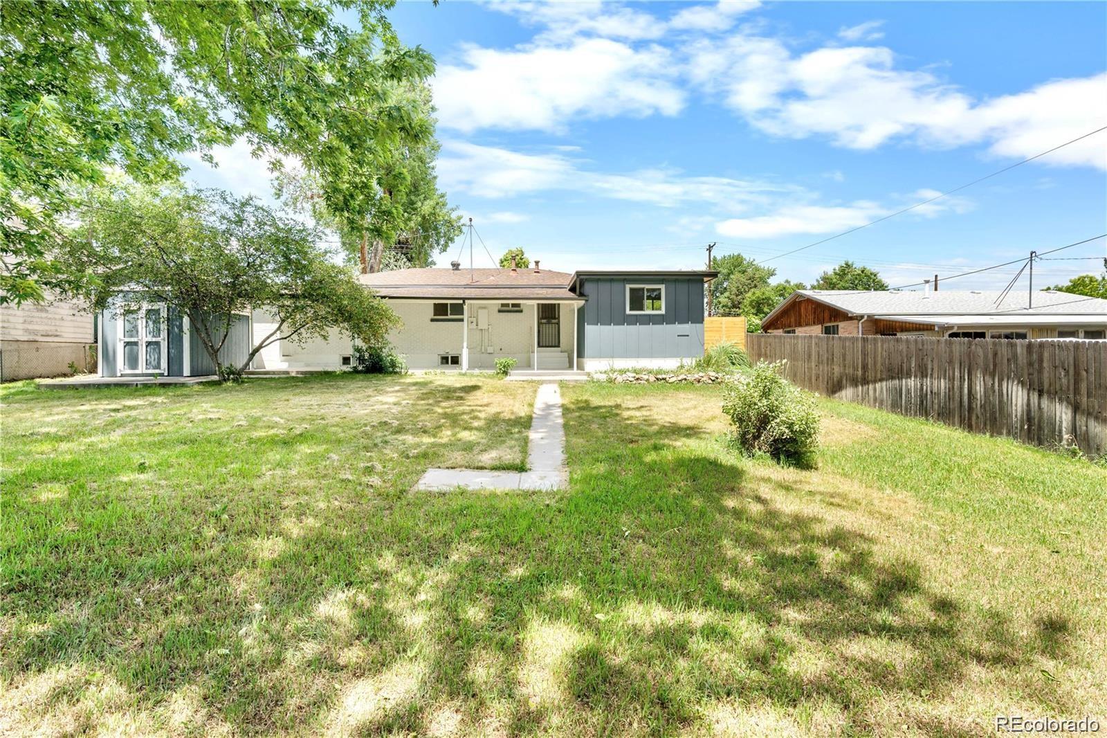 6500 West 32nd Avenue Wheat Ridge, CO 80033 - Photo 33 of 39 a view of a house with a yard