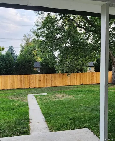 a view of a house with a tree