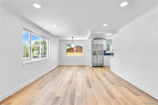 a view of a kitchen with a sink and a window