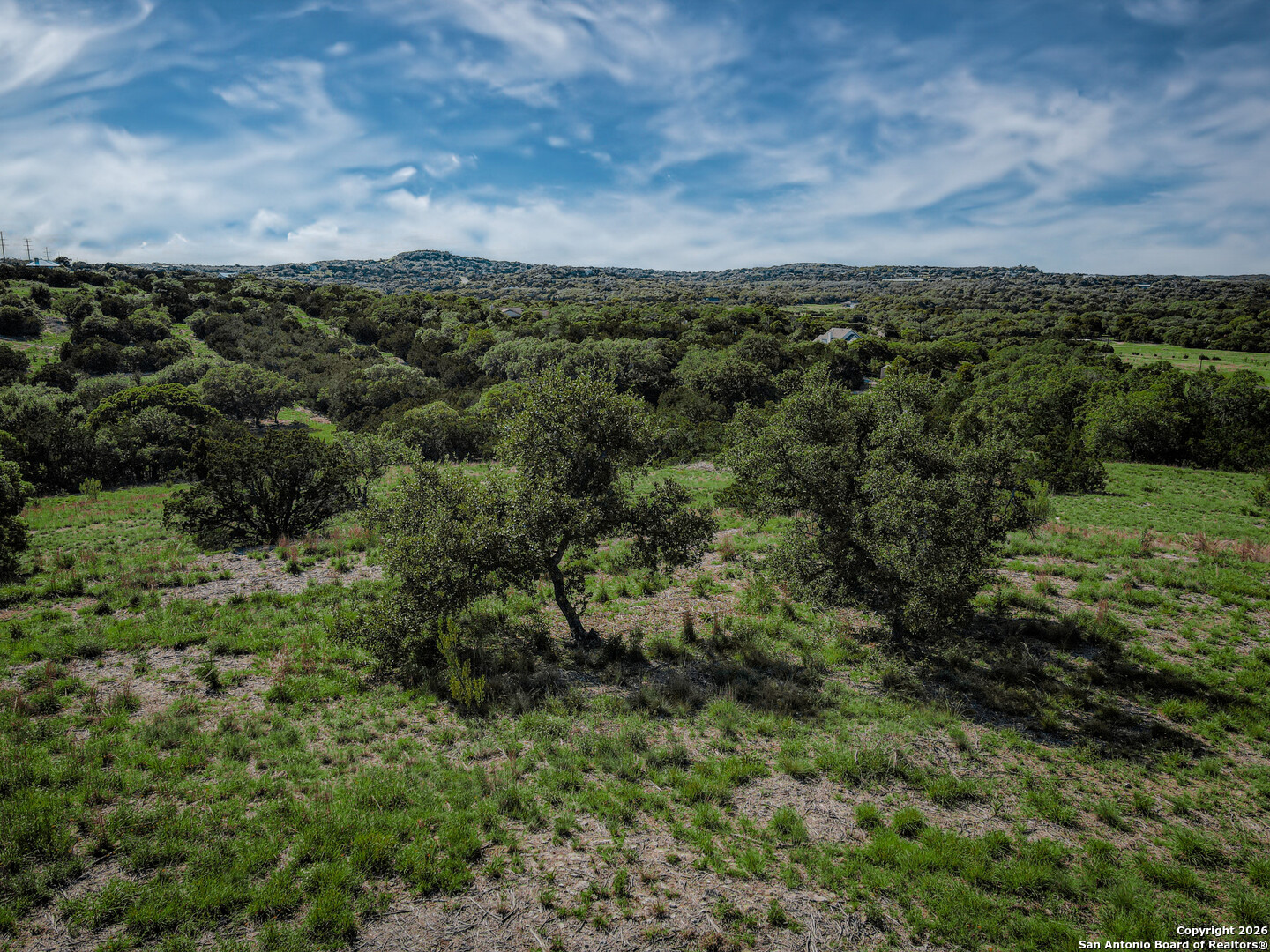 818 Lovett Rdg Road Bulverde, TX 78163 - Photo 3 of 12 an aerial view of residential houses with outdoor space and trees
