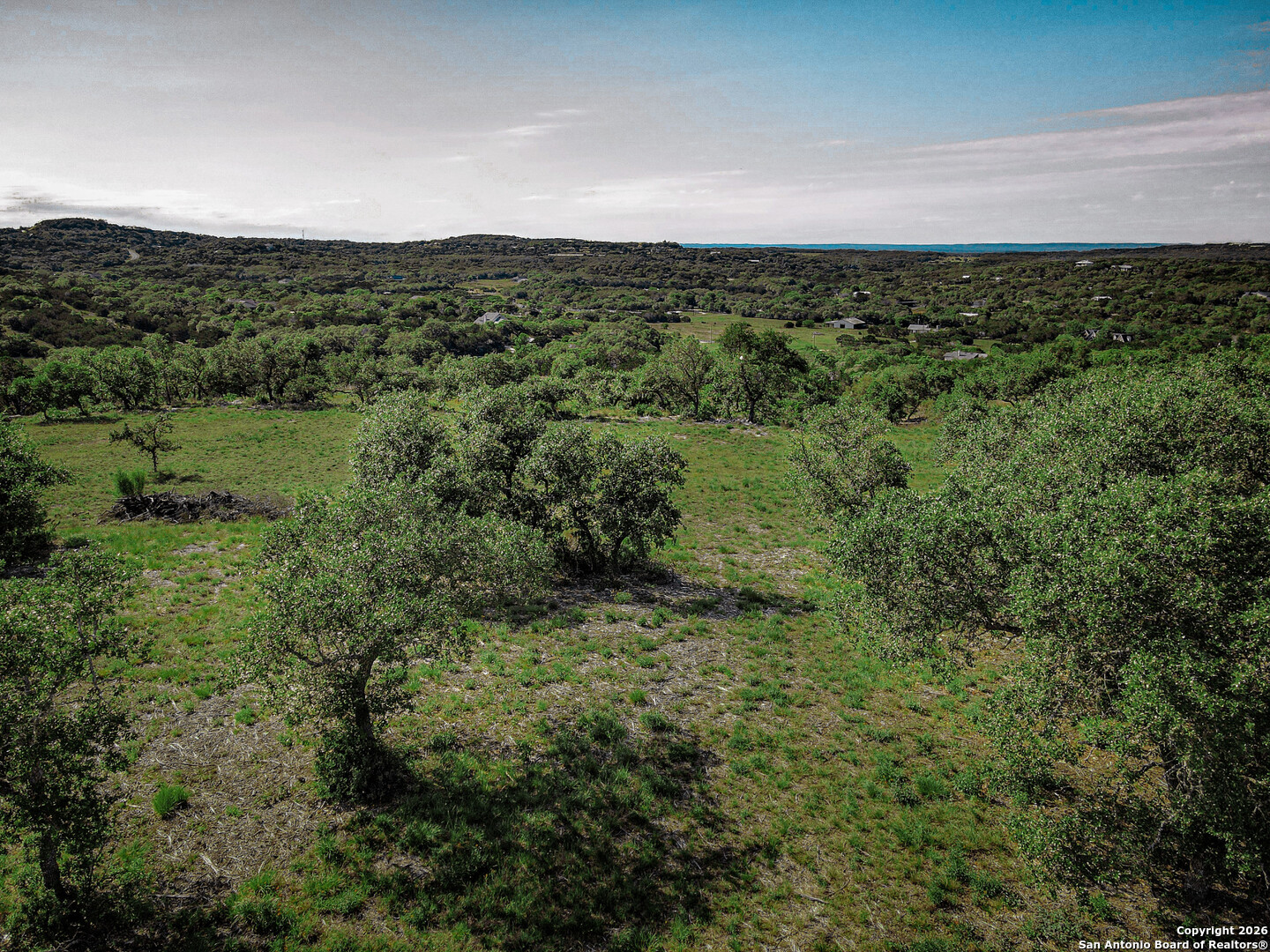 818 Lovett Rdg Road Bulverde, TX 78163 - Photo 6 of 12 a view of a green field in the middle of a field