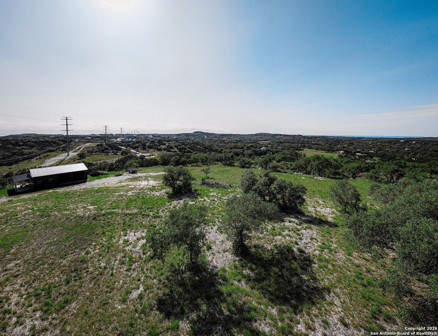 818 Lovett Rdg Road Bulverde, TX 78163 - Photo 7 of 12 an aerial view of a residential houses with outdoor space and trees