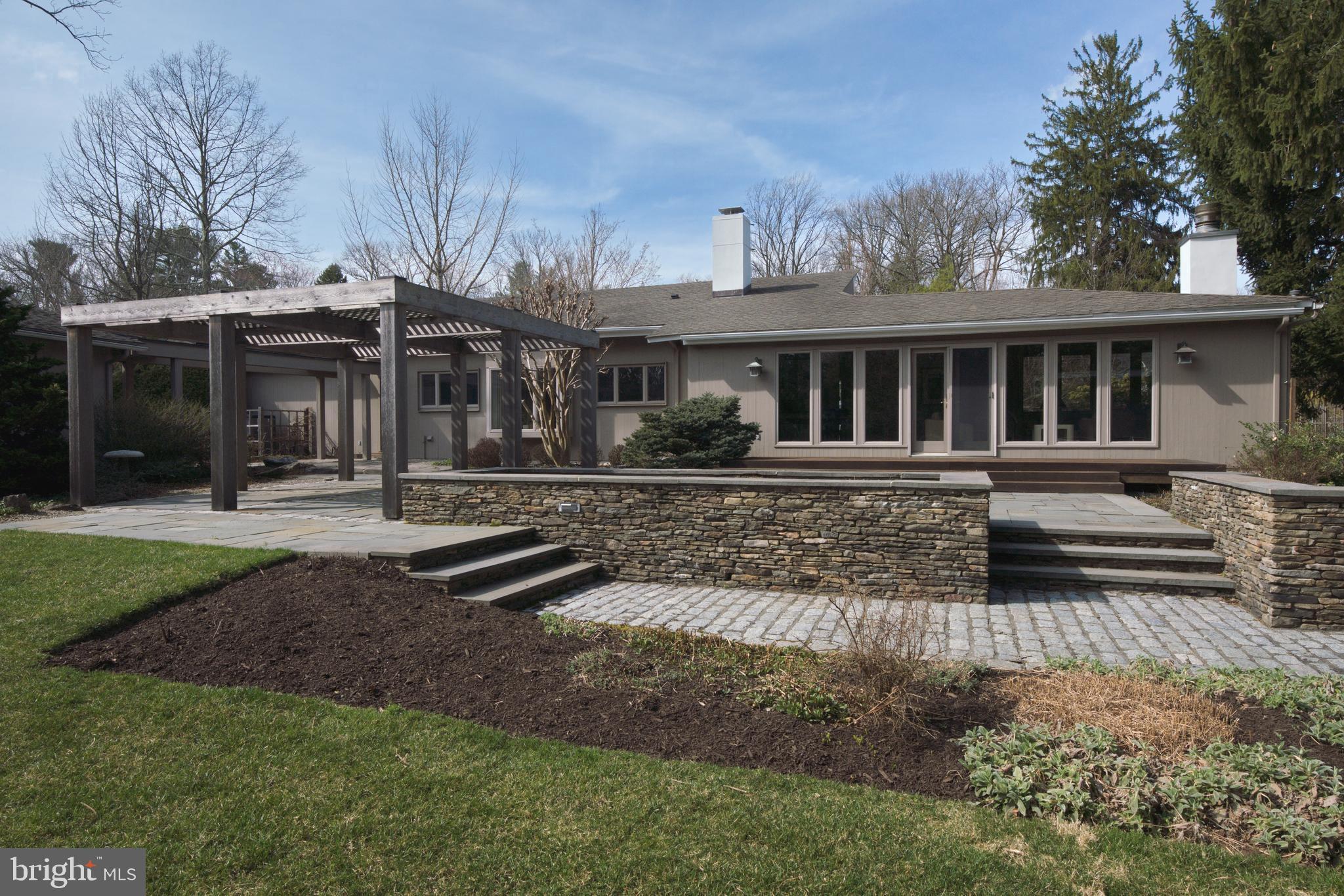 6 Ober Road Princeton, NJ 08540 - Photo 2 of 49 Rear stone walls & patio, pergola and deck.