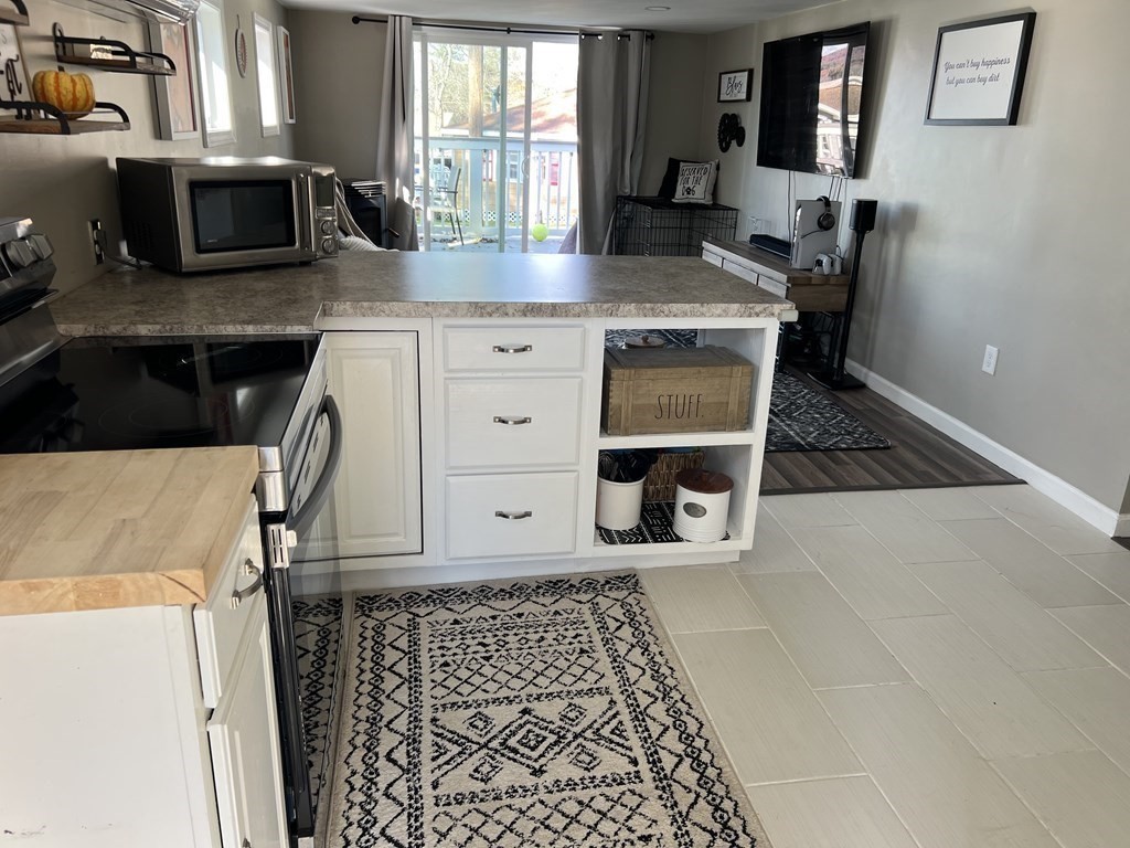 12 Sichols Colony Road Wales, MA 01081 - Photo 5 of 19 a kitchen with a stove and a microwave