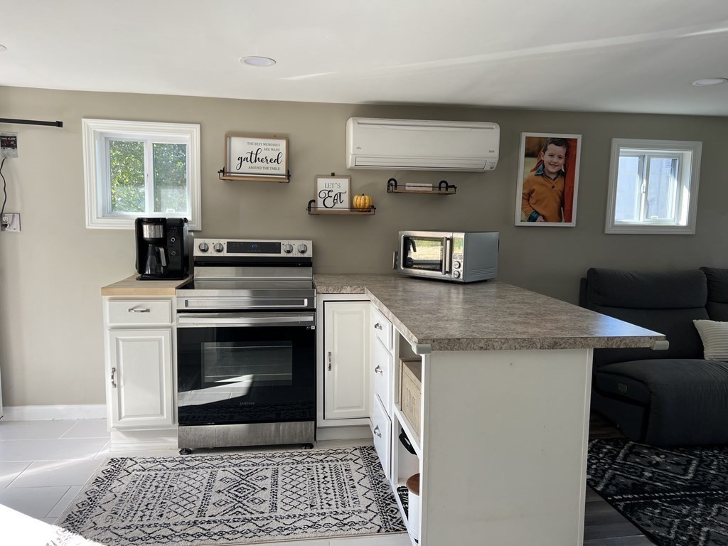 12 Sichols Colony Road Wales, MA 01081 - Photo 8 of 19 a kitchen with a stove and a refrigerator