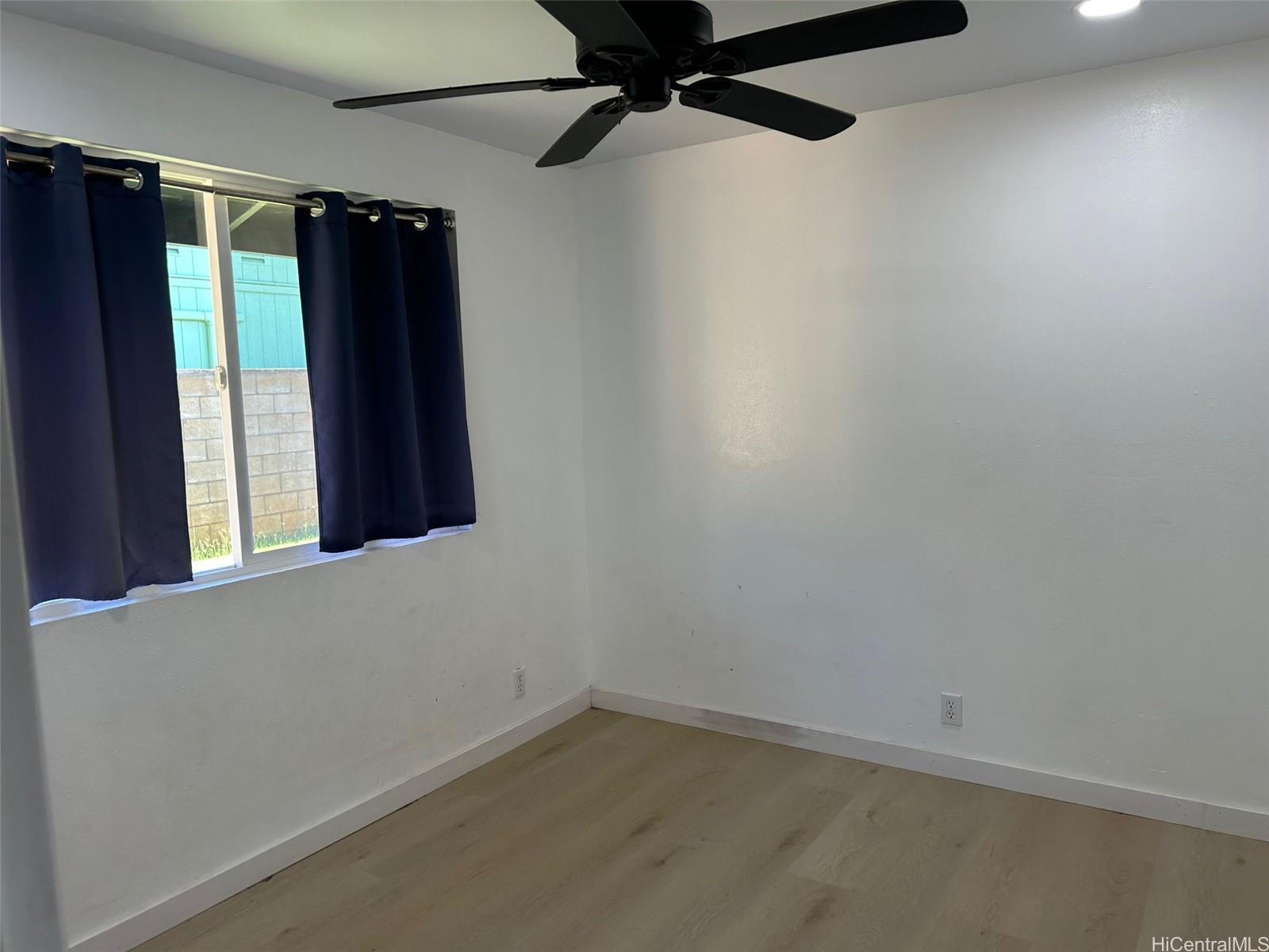 84-116 Kapakai Place Waianae, HI 96792 - Photo 10 of 14 an empty room with a window and a ceiling fan