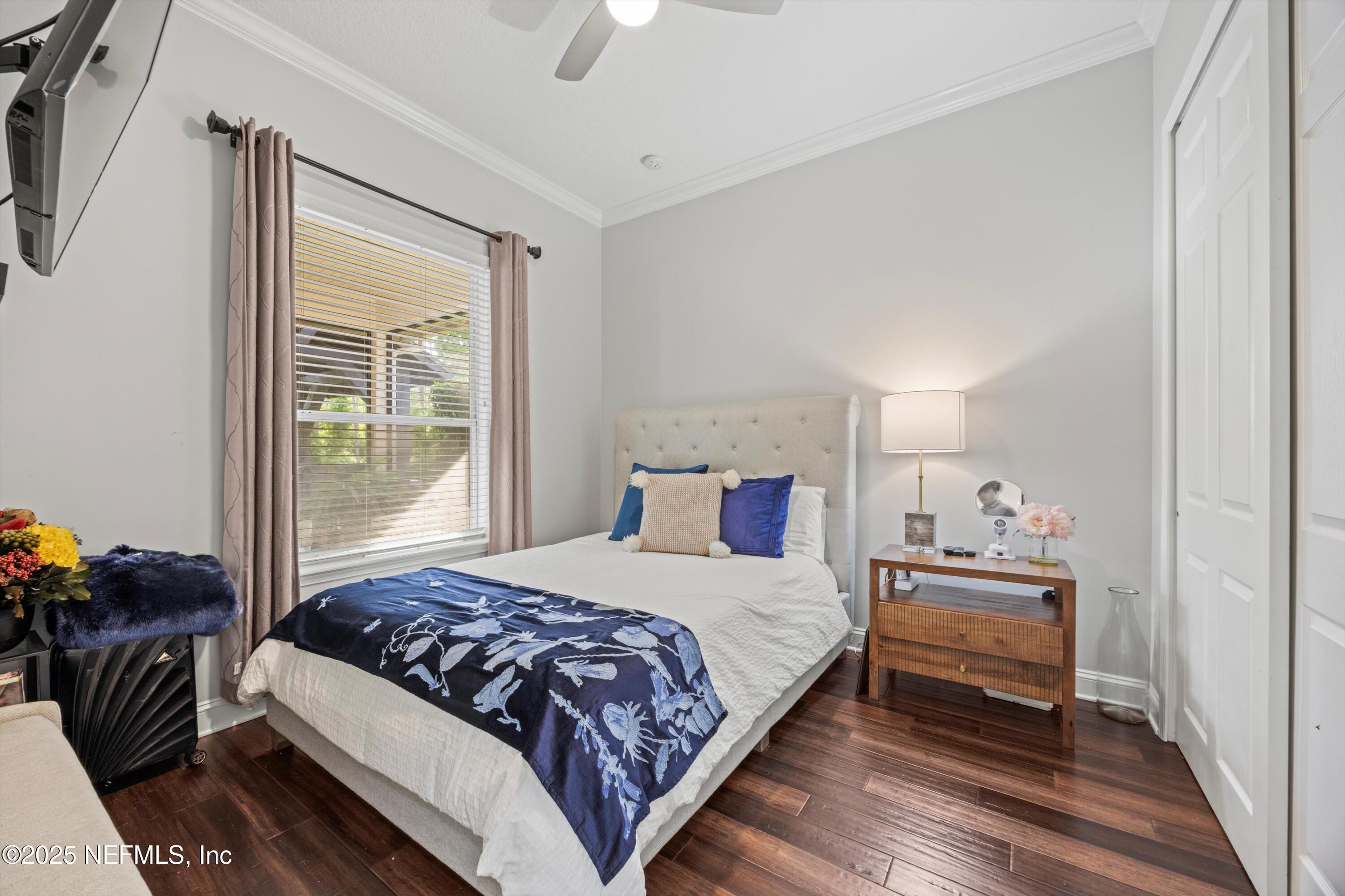 552 Saddlestone Drive St. Johns, FL 32259 - Photo 29 of 46 a bedroom with a bed and window