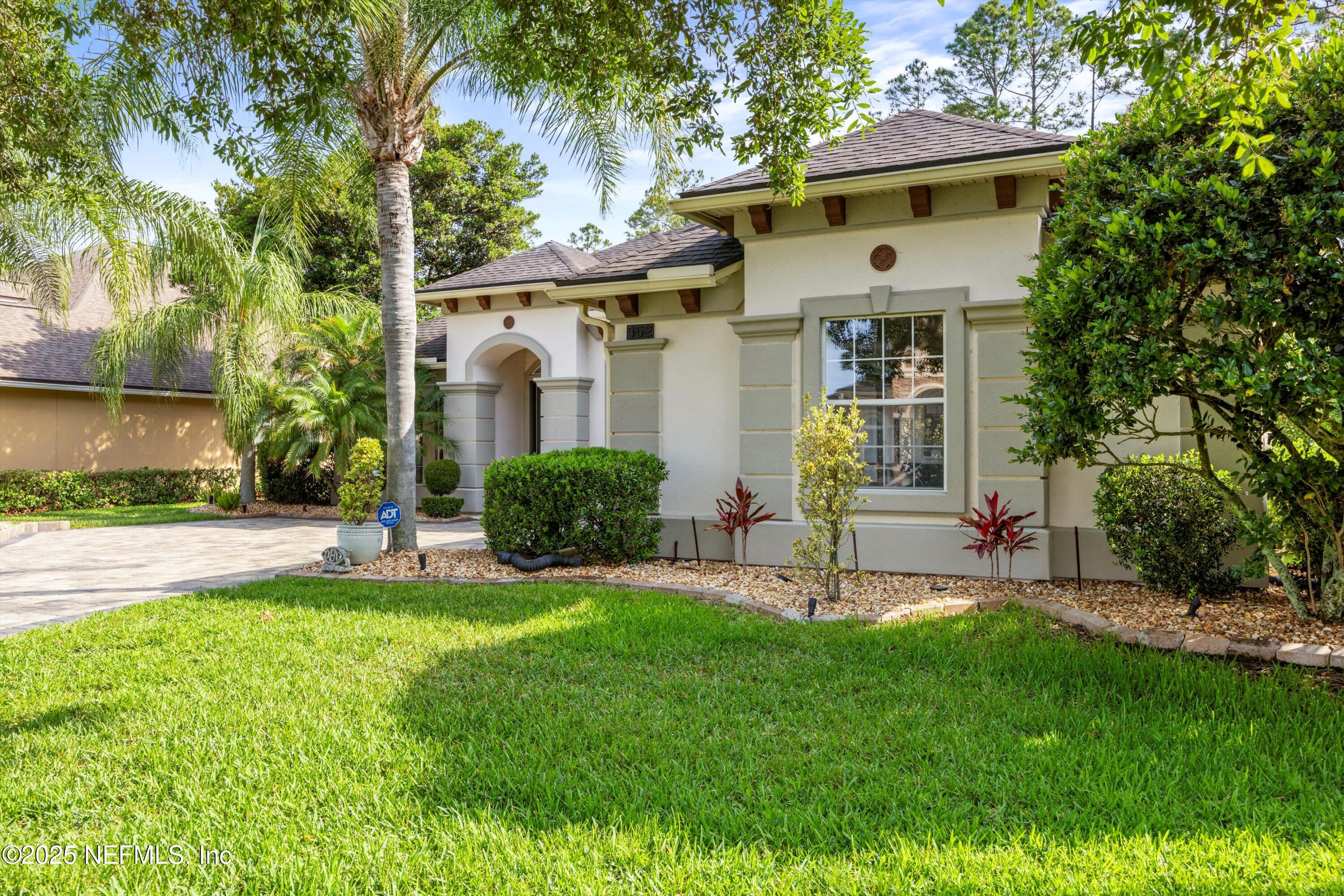 552 Saddlestone Drive St. Johns, FL 32259 - Photo 3 of 46 a view of a chair and table in backyard of the house
