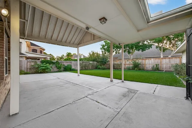 a view of a house with a yard and pathway