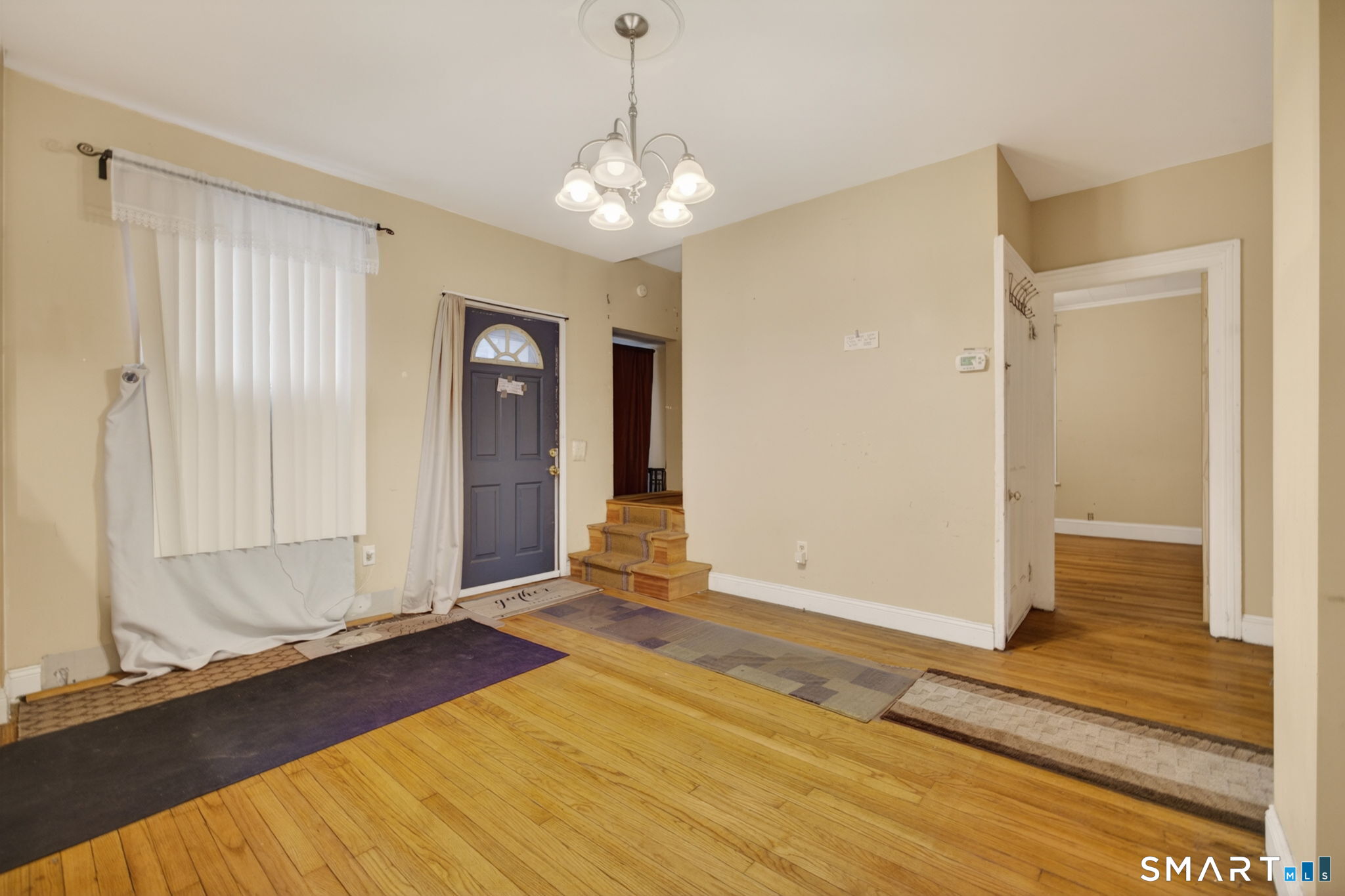 670 Hanover Road Meriden, CT 06451 - Photo 17 of 40 a view of a livingroom with wooden floor and door