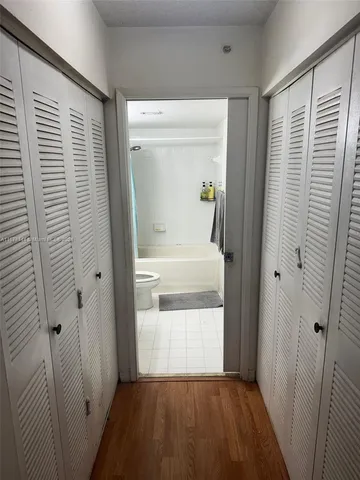 a view of a bathroom from a hallway