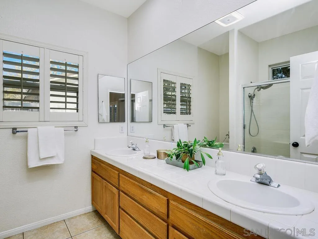 16304 Dartolo Road Ramona, CA 92065 - Photo 20 of 36 a bathroom with a sink and a mirror