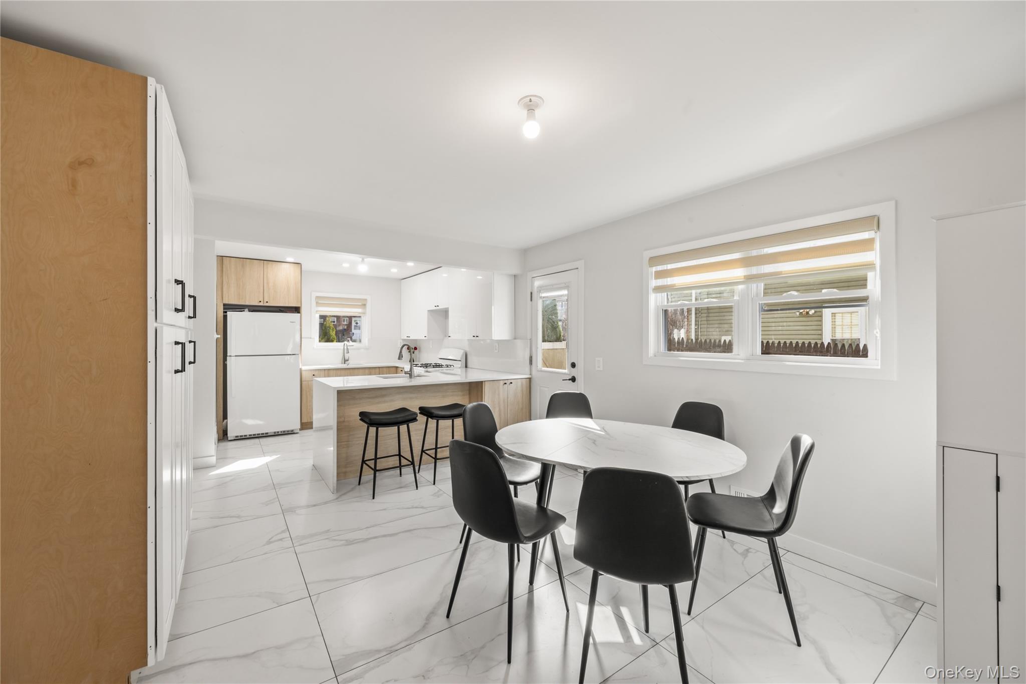 10 Sneden Court Spring Valley, NY 10977 - Photo 12 of 42 a view of a dining room with furniture and a large window