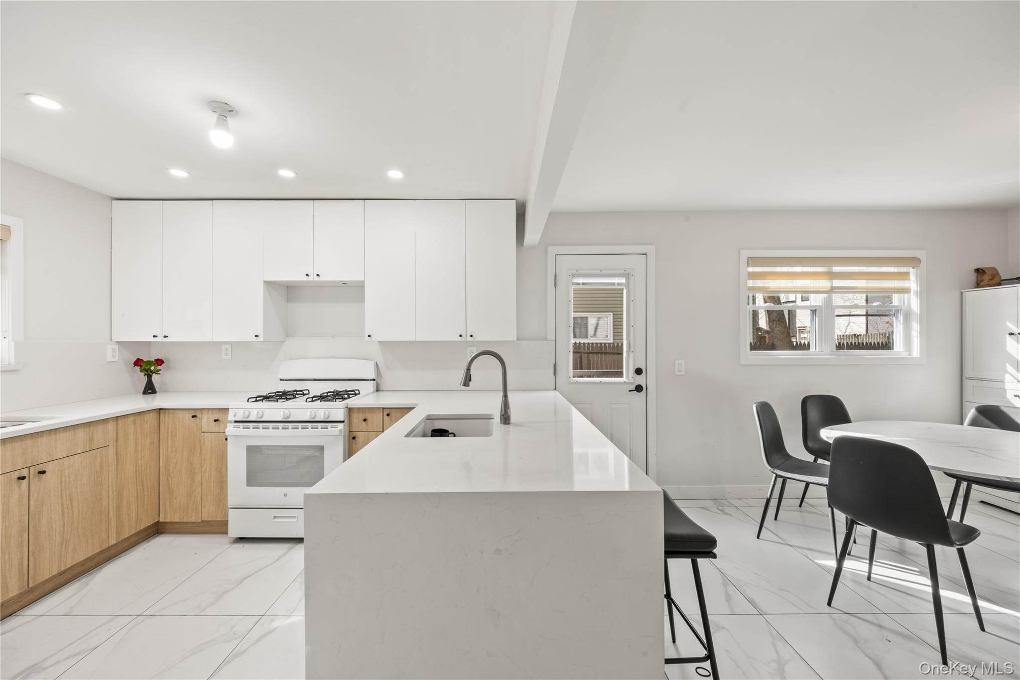 10 Sneden Court Spring Valley, NY 10977 - Photo 13 of 42 a kitchen that has a table and chairs in it