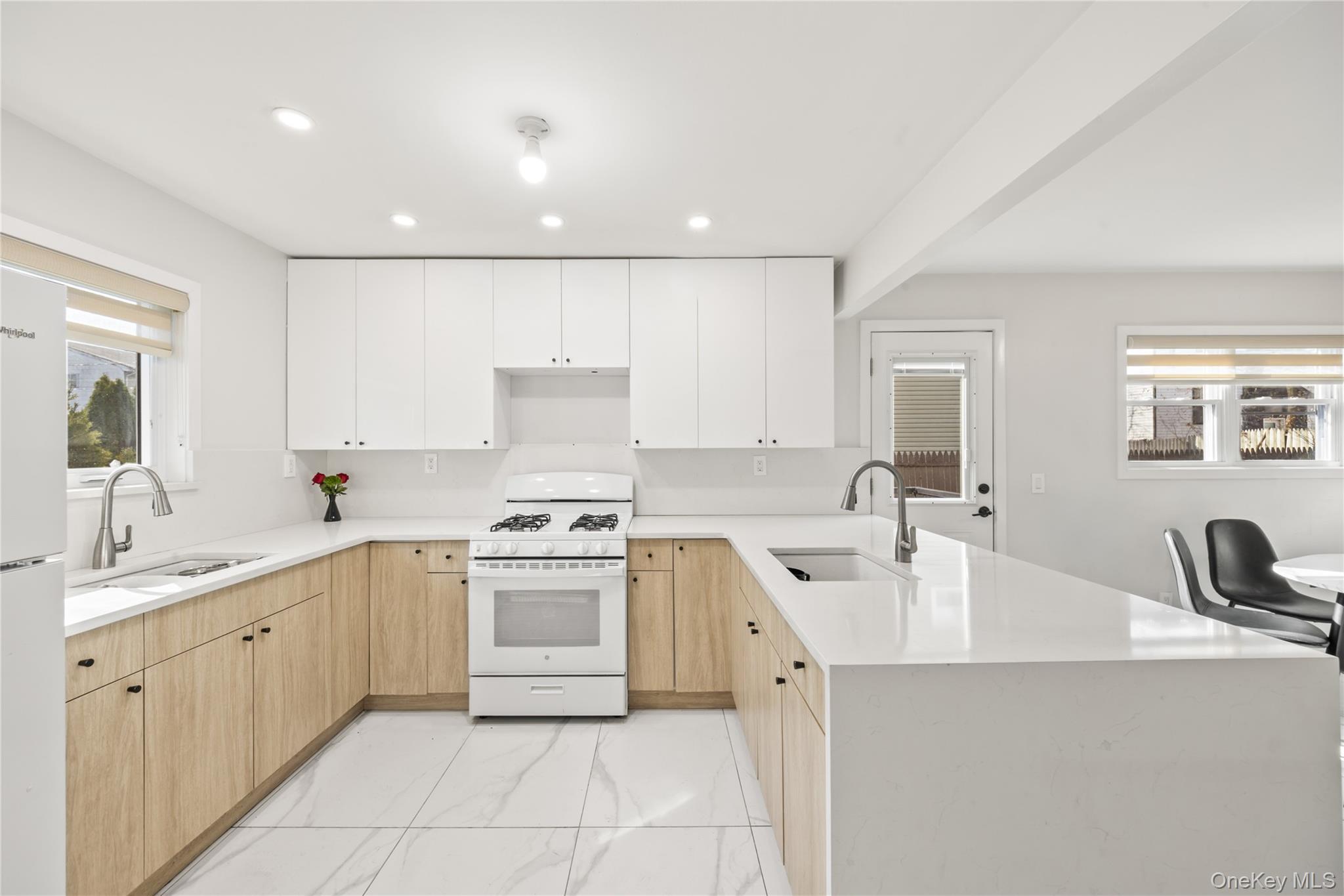 10 Sneden Court Spring Valley, NY 10977 - Photo 15 of 42 a kitchen with a sink stove and cabinets