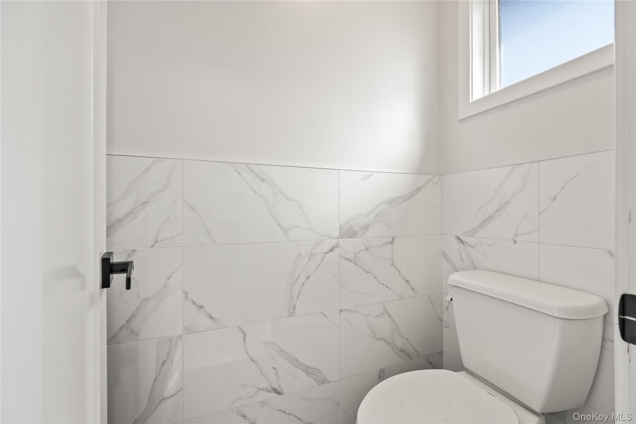 10 Sneden Court Spring Valley, NY 10977 - Photo 21 of 42 a white toilet sitting next to a white wall