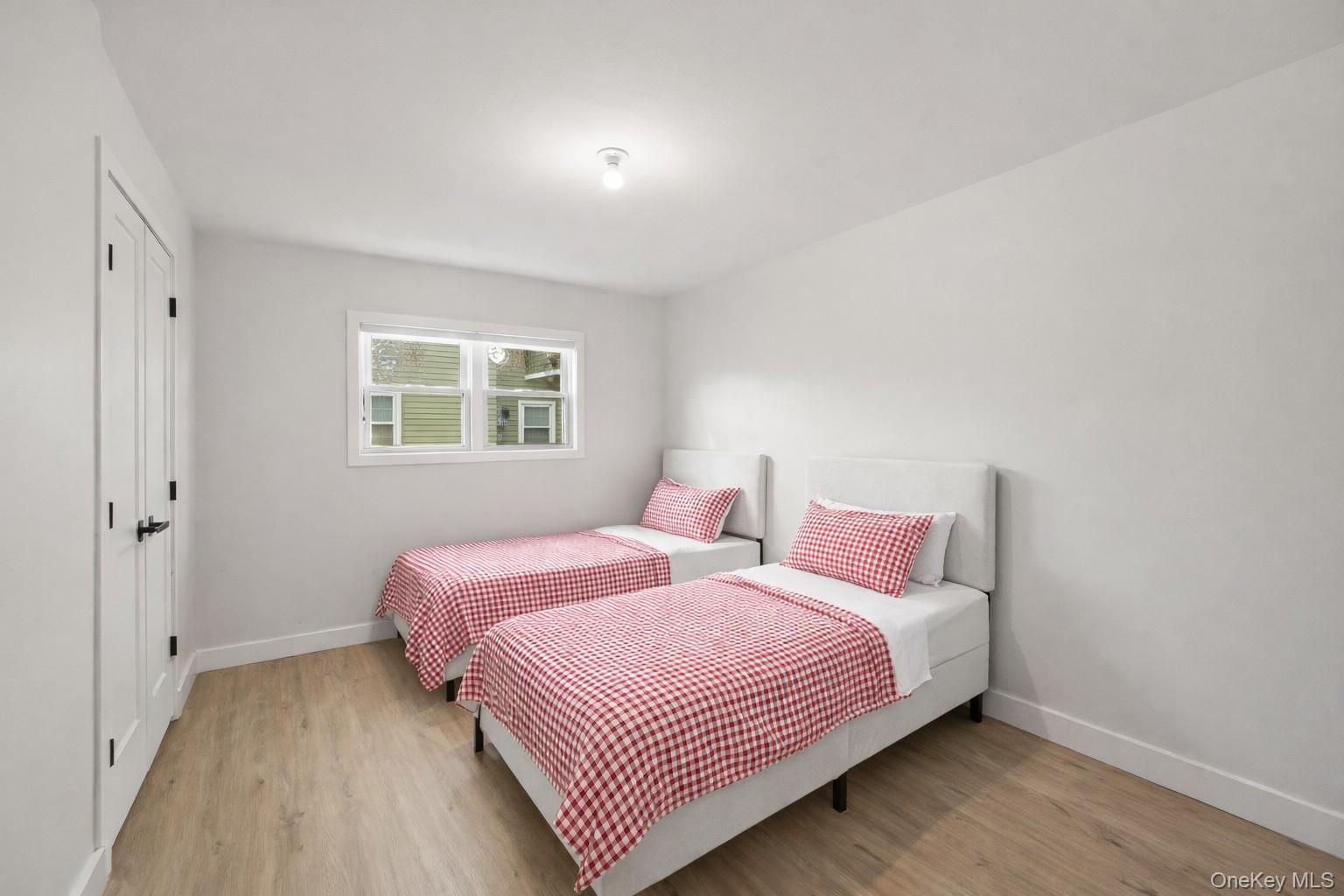 10 Sneden Court Spring Valley, NY 10977 - Photo 27 of 42 a bedroom with a bed and a window