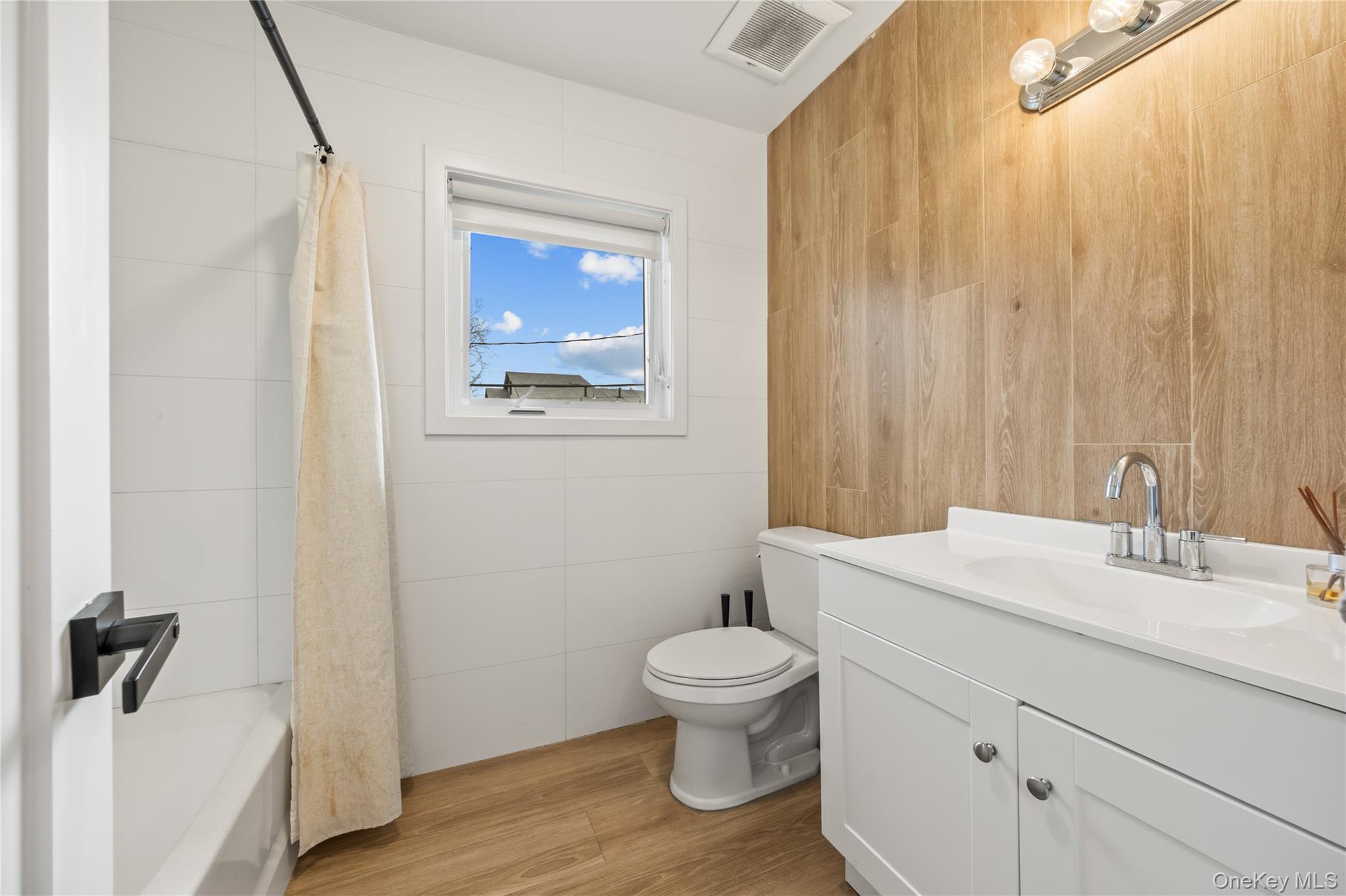 10 Sneden Court Spring Valley, NY 10977 - Photo 29 of 42 a bathroom with a granite countertop sink toilet and mirror