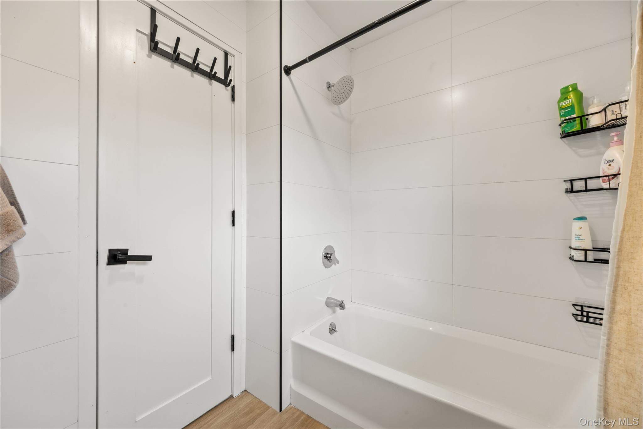 10 Sneden Court Spring Valley, NY 10977 - Photo 30 of 42 a bathroom with a bathtub and a shower