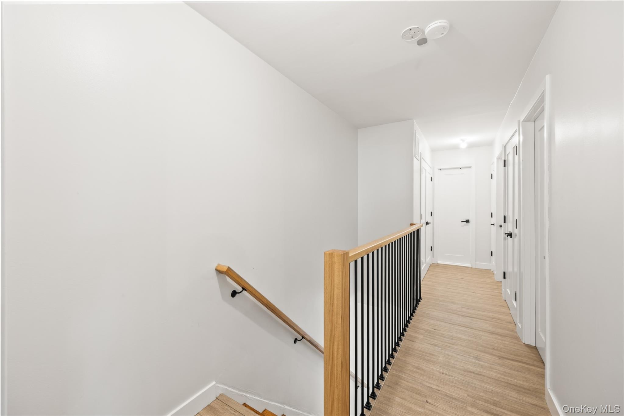 10 Sneden Court Spring Valley, NY 10977 - Photo 32 of 42 a view of a hallway with wooden floor