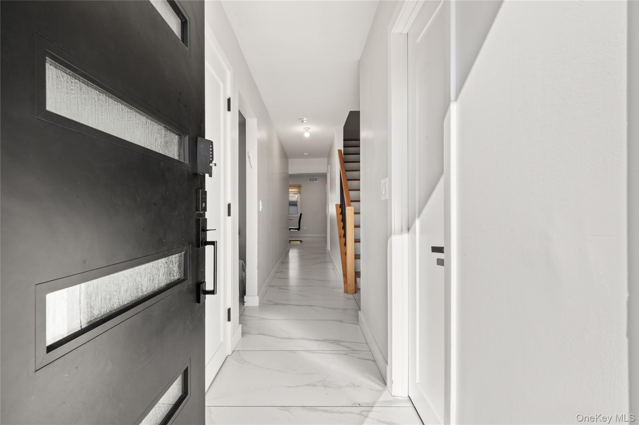 10 Sneden Court Spring Valley, NY 10977 - Photo 5 of 42 a view of a hallway with a white walls and stairs