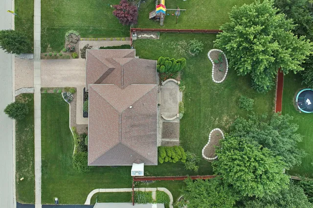 an aerial view of a house having patio