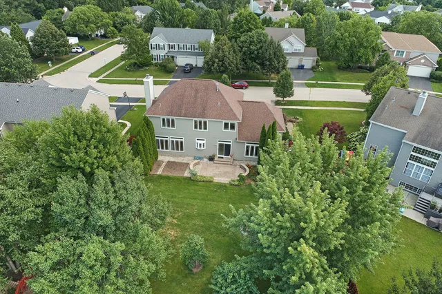 an aerial view of a house with a garden