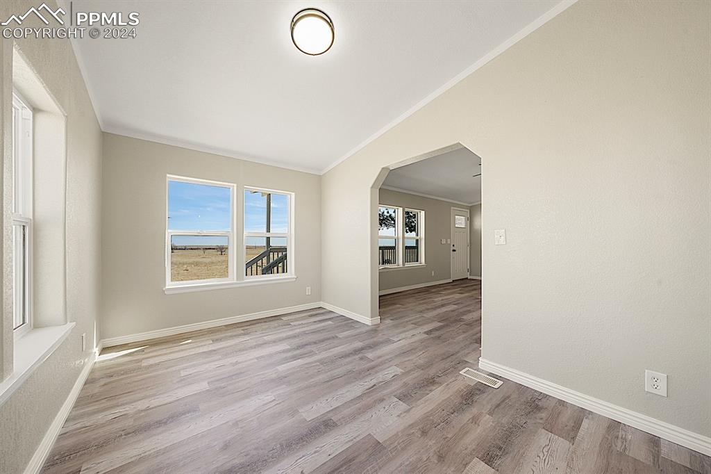 8160 Edison Road Yoder, CO 80864 - Photo 17 of 42 an empty room with windows and closet