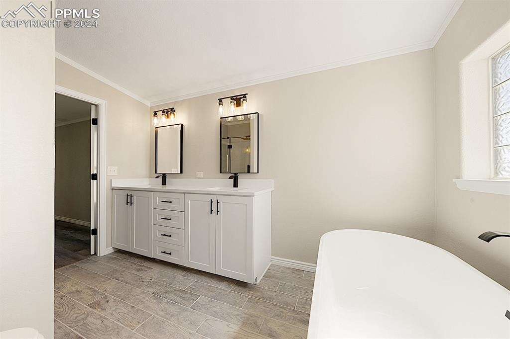 8160 Edison Road Yoder, CO 80864 - Photo 24 of 42 a bathroom with a double vanity sink mirror and